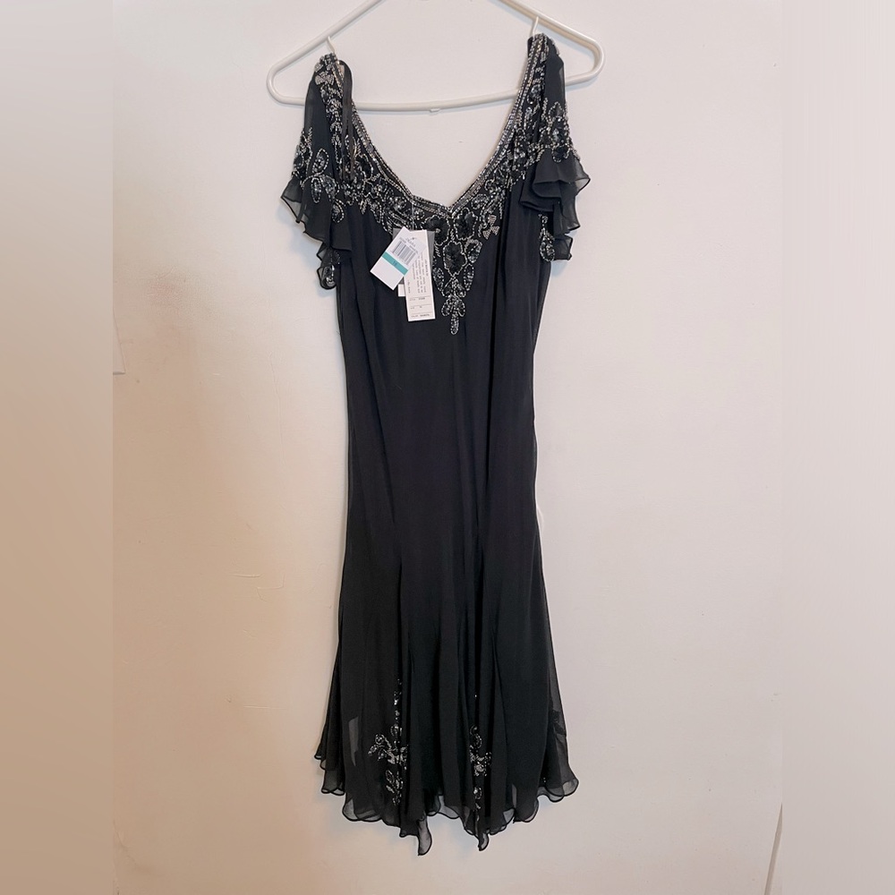 Brand new dress with tags size 16 never worn.  Brand Jakara